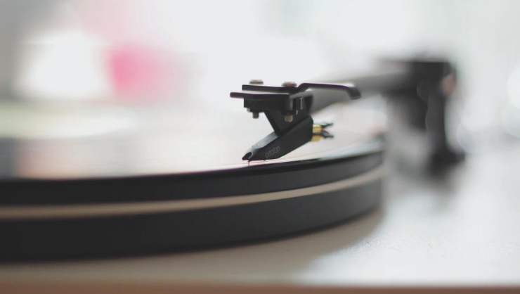 Artistic soft focus photograph of a record playing on a turntable