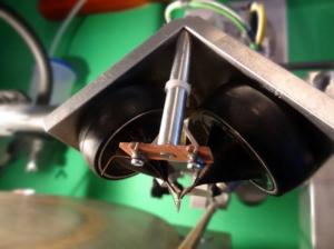 A disc cutting lathe head used in the production of vinyl records